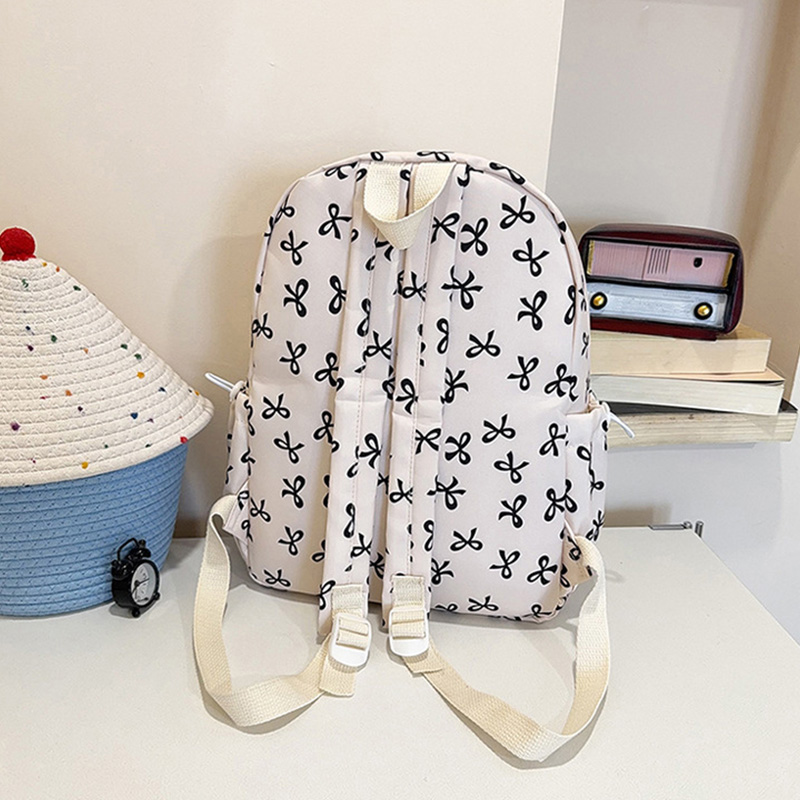 حقيبة ظهر لطيفة بطبعة فيونكات  - مراجعة School Backpack Teen وسعره